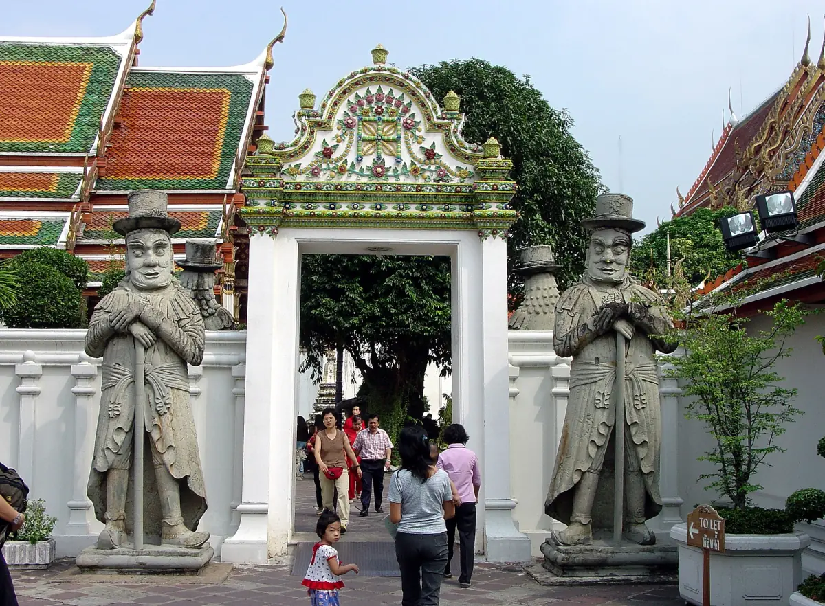 Stone guardian statues at a gate of Wat Pho